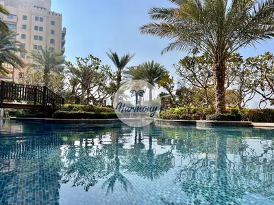 a swimming pool with a ball in the middle of it at Harmony Vacation Homes - North Residence in Dubai