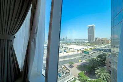 a view of a city from a hotel window at Blue dream apartment with Harbour view in Marina in Dubai