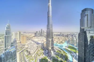 an aerial view of a city with a tall skyscraper at Burj Vista, Downtown Dubai - Burj Khalifa View - Mint Stay in Dubai