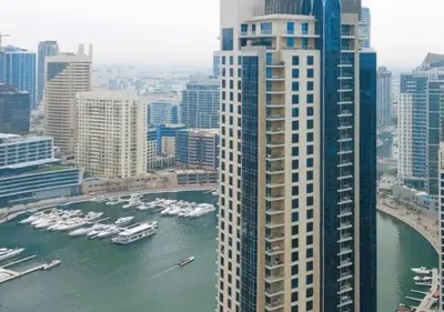 a view of a large city with boats in the water at Spacious 2 BR with Amazing Marina View Rimal JBR in Dubai