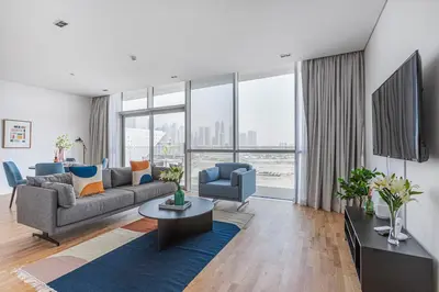 a living room with a couch and a table at Vonder: City Walk in Dubai