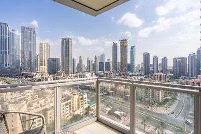 a balcony with a view of a city at Splendid 3BR Apartments - Burj Khalifa & Fountain Views - 5 Minutes Walk from Dubai Mall in Dubai