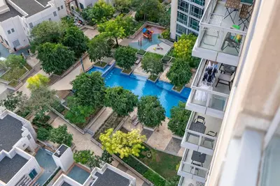 an aerial view of a pool in the middle of a building at Splendid 3BR Apartments - Burj Khalifa & Fountain Views - 5 Minutes Walk from Dubai Mall in Dubai