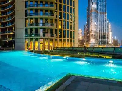 a swimming pool in a city with tall buildings at Luxury 2BR Sea & Skyline Views Near Metro & Burj Khalifa in Dubai