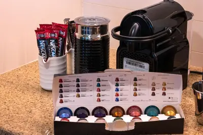 a box of eggs on a counter next to a coffee maker at Luxury 2BR Sea & Skyline Views Near Metro & Burj Khalifa in Dubai
