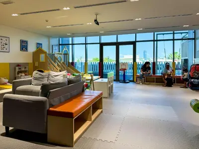 a waiting room with a couch and people sitting at Spacious beachfront 2 bedroom apartment - The 8 in Dubai