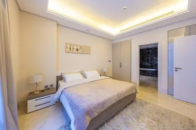 a bedroom with a large bed in a room at Cozy beachfront 1 bedroom apartment - The 8 in Dubai