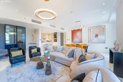 a living room with a couch and a table at JBR Amwaj 4 , Upgraded Sea and Ain Dubai Views, 2m walk to Beach By Gardenia Suitse in Dubai