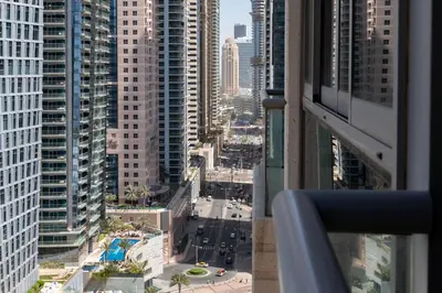 a view of a city street from a skyscraper at Vacay Lettings - 2BHK with Dubai Marina View in Dubai