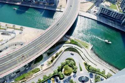 an overhead view of a bridge with a highway at Prime 1BR with Marina Views and Beach Access in Dubai