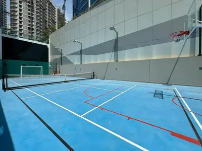 an empty basketball court with a net on it at Luxury Studios with Burj Khalifa View or Canal view - Marquise Square Tower in Dubai