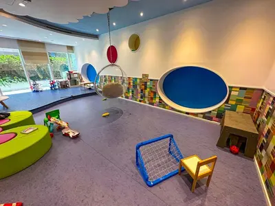 a childrens room with a play area with toys in it at AWS Holiday Homes - Unique Views at Damac Heights in Dubai
