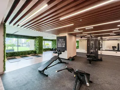 a gym with treadmills and exercise equipment in a building at Luton Vacation Homes - Elite Residence Downtown, Dubai in Dubai
