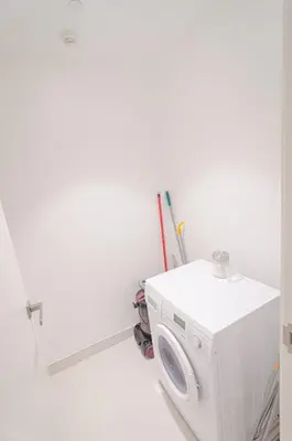 a laundry room with a washer and dryer at Outstanding New Apartment with Sea View In La Mer in Dubai