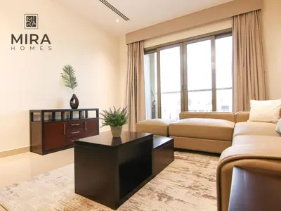 a living room with a couch and a coffee table at Mira Holiday Homes - Lovely 1 bedroom apartment in Downtown in Dubai