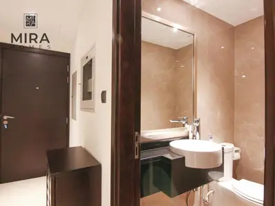 a bathroom with a sink and a mirror at Mira Holiday Homes - Lovely 1 bedroom apartment in Downtown in Dubai