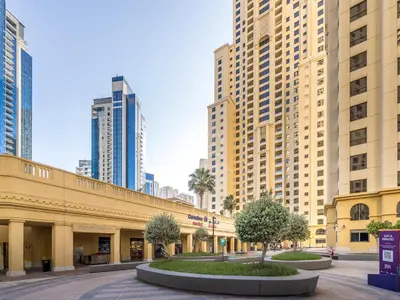 a street with tall buildings in a city at 2 BD apartment in Bahar JBR in Dubai