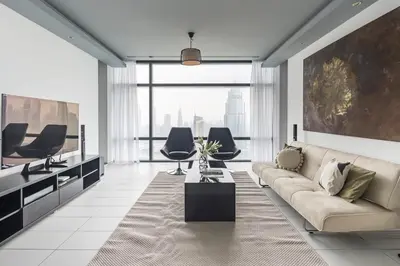 a living room with a couch and some chairs at Frank Porter - Index Tower in Dubai