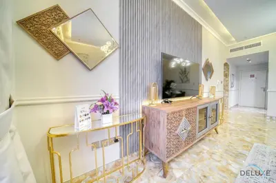 a bathroom with a vanity and a mirror on the wall at Ornate 2BR at Diamond Views 1, Jumeirah Village Circle by Deluxe Holiday Homes in Dubai
