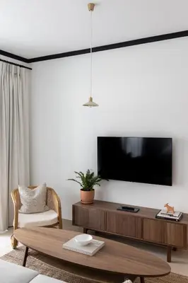 a living room with a tv and a coffee table at Studio in Burj Views by Radiance Vacation Stays in Dubai
