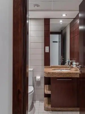 a bathroom with a sink and a toilet at Studio in Burj Views by Radiance Vacation Stays in Dubai
