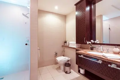a bathroom with a toilet and a sink and a shower at Elite Royal Apartment - Full Burj Khalifa & Fountain View - Magnum in Dubai
