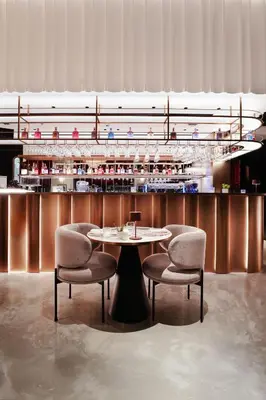 a table and two chairs in a room at Lusso Hometels J One Business Bay in Dubai
