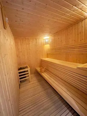 a large wooden sauna with a bench in it at STAY BY LATINEM Luxury 2BR Holiday Home CV B2513 near Burj Khalifa in Dubai