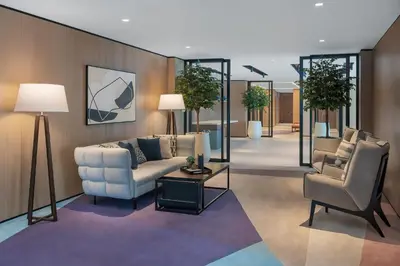 a living room with a couch and two chairs at Vida Dubai Marina & Yacht Club in Dubai