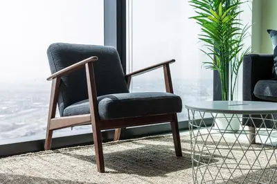 a chair and a table in a room with a window at 72 floor 2BR at the Address JBR with Marina Views! in Dubai