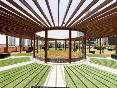a building with a large wooden structure with a garden at Luxury Burj Khalifa View Studio Elite Downtown - 18AB19AB03 in Dubai