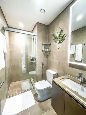a bathroom with a toilet and a shower and a sink at STAY BY LATINEM Luxury 1BR Holiday Home CV A107 near Burj Khalifa in Dubai