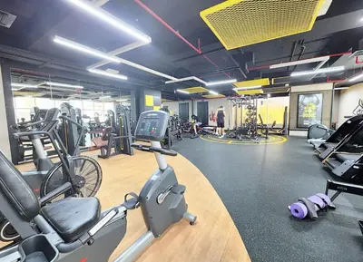 a gym with treadmills and exercise bikes in it at RH- Contemporary Studio, Downtown, Near Dubai Mall & Burj Khalifa in Dubai