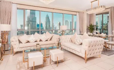 a living room with white furniture and large windows at Elite Royal Apartment - Full Burj Khalifa & Fountain View - Grace in Dubai