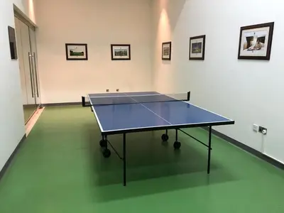 a ping pong table in the middle of a room at Elite Royal Apartment - Full Burj Khalifa & Fountain View - Grace in Dubai
