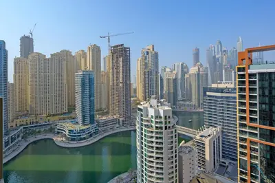 a view of a city with a river and buildings at Marina Canal Views from the Balcony, Close to Marina Mall, The Address Residences, Dubai Marina by Deluxe Holiday Homes in Dubai