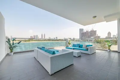 a balcony with couches and a view of the city at 2BDR apartment with full sea view and Dubai Marina view Azure Residences in Dubai