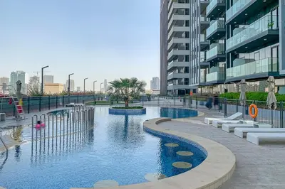 a swimming pool in the middle of a building at Frank Porter - Bloom Tower A in Dubai