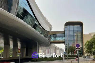 a large building with a sign in front of it at Birchfort - Newly renovated unique 1 bedroom apartment in Dubai