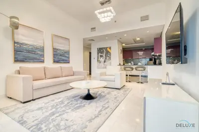 a living room with a couch and a table at Sea Views from Living to Bedroom Perfect for Staycation, Dubai Marina by Deluxe Holiday Homes in Dubai