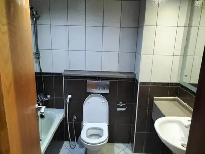 a small bathroom with a toilet and a sink at Amazing apartment 2 bed rooms in Tecom 6 pax in Dubai