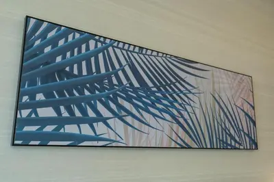 a painting hanging on a wall in a room at Palm Tower where Luxury & View meet in one place in Dubai
