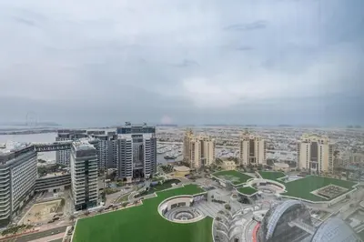an aerial view of a city with tall buildings at Palm Tower where Luxury & View meet in one place in Dubai