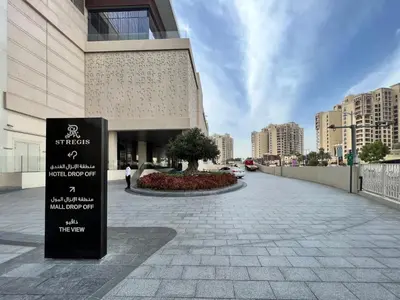 a building with a sign in front of it at Palm Tower where Luxury & View meet in one place in Dubai
