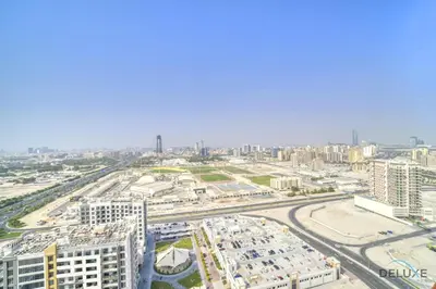 an aerial view of a city with buildings and roads at Homely 1BR at Binghatti Avenue Al Jaddaf by Deluxe Holiday Homes in Dubai