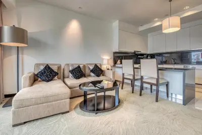 a living room with a couch and a table at Graceful 1BR at The Address Residences Dubai Marina by Deluxe Holiday Homes in Dubai