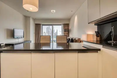 a kitchen with a large island in a room at Graceful 1BR at The Address Residences Dubai Marina by Deluxe Holiday Homes in Dubai