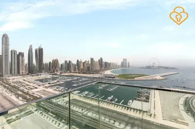 a view of the city of dubai from a skyscraper at Fascinating Views! Large 4BR Private Beach Access, Emaar BeachFront in Dubai