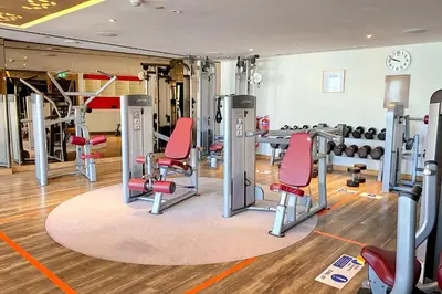 a gym with treadmills and exercise machines at ALiving Elegant 1BR I Burj Khalifa View I Paramount Towers- 6103 in Dubai