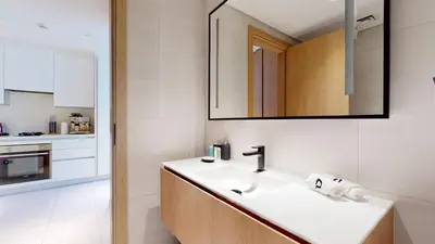 a bathroom with a sink and a mirror at Stylish Studio with Burj Khalifa View in Dubai
